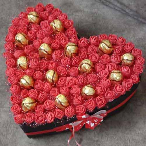 Delightful Heart Arrangement of Sapphire Hazelfills Chocolates on Roses