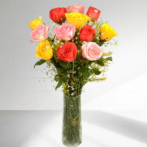 Soft Orange Yellow N Pink Color Roses in a Crystal Vase 	