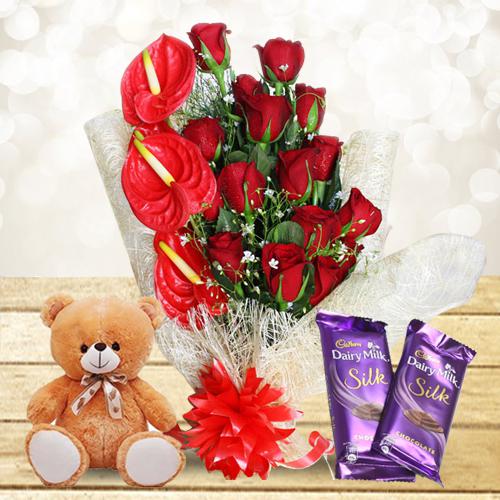 Mesmerizing Gift of Red Flowers Bouquet with Cute Teddy n Chocolates