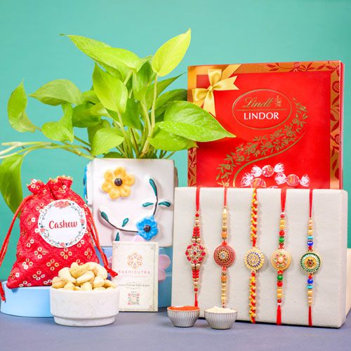 Delightful Rakhi Gift Ensemble with Lindt  N  Golden Pothos