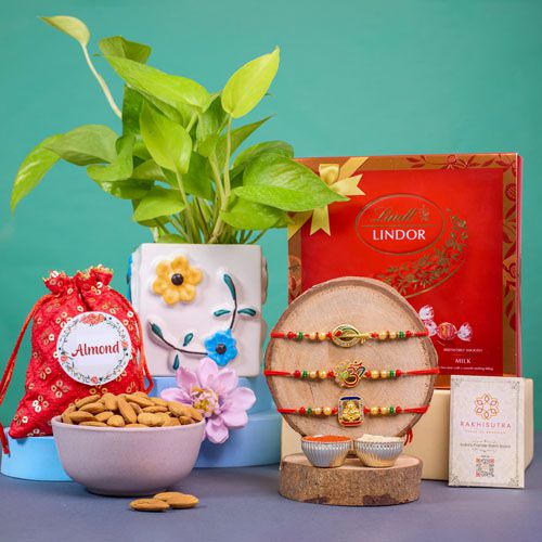 Sacred Rakhi Trio with Chocolates and Greens