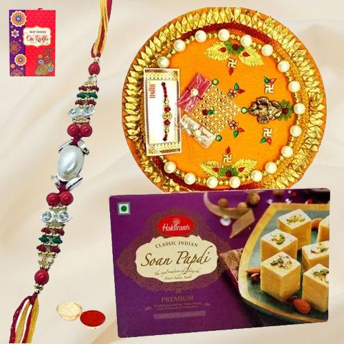 Delicious Pack of Rakhi Special Soan Papri from Haldiram and Thali along with Rakhi Roli Tilak and Chawal