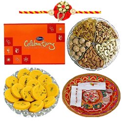 Lovely Brotherly Love Gift of Cadbury Celebration Chocolate Pack Mixed Dry Fruits Haldiram Kesar Peda Shree Thali and 1 Trendy Zardoji Rakhi with Free Roli Tika and Chawal