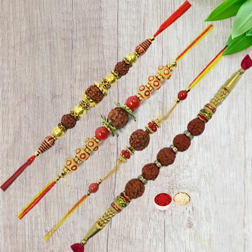 Beautifying Display of Four Pious Rudraksha Rakhi with Free Roli Tika and Chawal for your Dear Ones