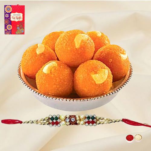 Breathtaking Arrangement of Free Decorative Rakhi Roli Tilak and Chawal with Haldiram Pure Ghee Ladoo for this Rakhi Festival